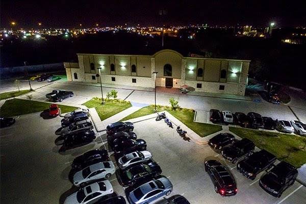 Aerial nighttime view of Bucks Wild Fort Worth and its illuminated parking lot